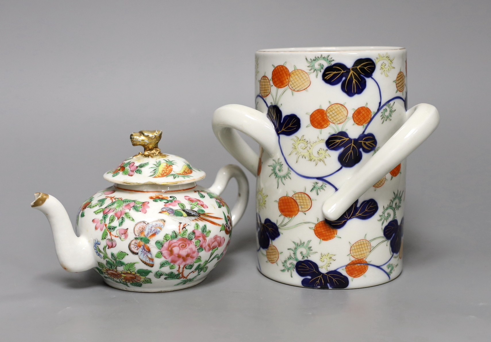 A Chinese Canton decorated famille rose teapot and a Japanese Fukugawa three handled vase (2), tallest 15cm